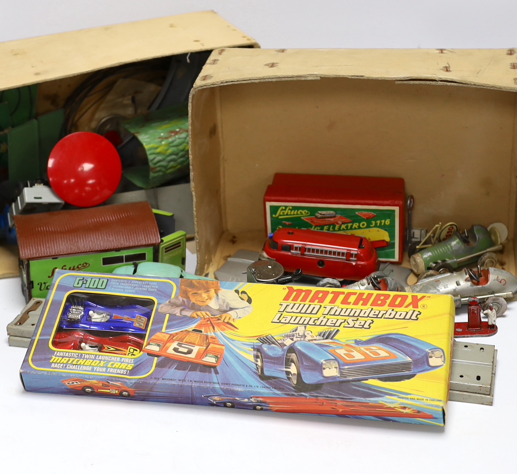 A boxed Matchbox Twin Thunderbolt Launcher set G-100, together with a quantity of Schuco Varianto items including four vehicles; a Varianto-Limo (3041), a Shell tanker, a fire engine, a pickup truck, garage, tunnel, trac